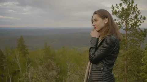 The girl is standing and thinking Video stock 94972273
