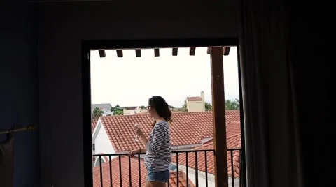Girl standing on the balcony Stock Footage 68652009