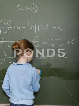 Girl Standing In Front Of Blackboard, Solving Arithmetic Problem