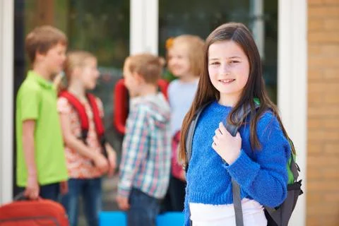 Girl Standing Outside School With Rucksack Stock Photos