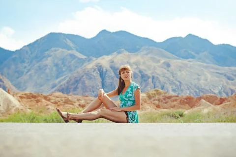 Girl standing on the road with her back Stock Photos