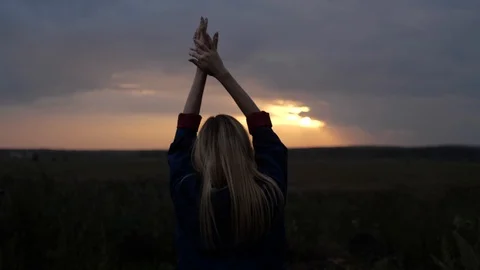 Girl standing at sunset Stock Footage 105290729