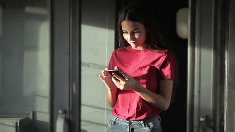 Girl standing in train and using smartphone Stock Footage 78883949