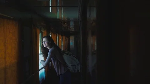Girl is standing in the wagon of train Stock Footage 76250041