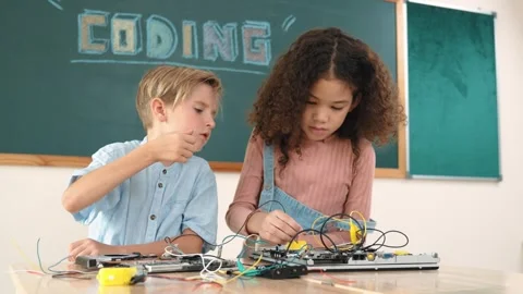 Girl standing while fixing electronic board by using screwdriver. Pedagogy. Stock Footage 267920943