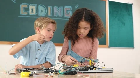 Girl standing while fixing electronic board by using screwdriver. Pedagogy. Stock Footage 274869972
