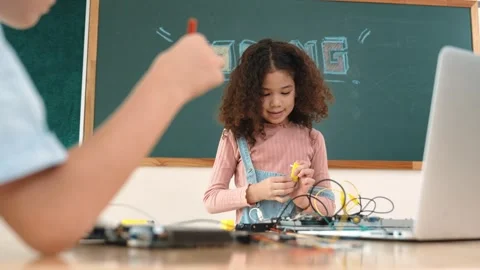 Girl standing while fixing electronic board by using screwdriver. Pedagogy. Stock Footage 283404384