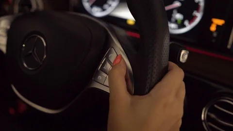 The girl starts the engine while sitting at the helm Stock Footage 91725826