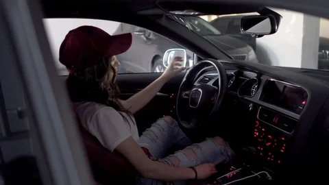 The girl starts the engine while sitting at the helm Stock Footage 91737328