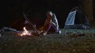 Girl Stood Up From A Burning Campfire And Went To Tent At Night Stock Footage