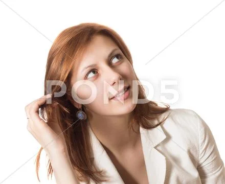 Girl straightens her hair and looking at the top Stock Photos