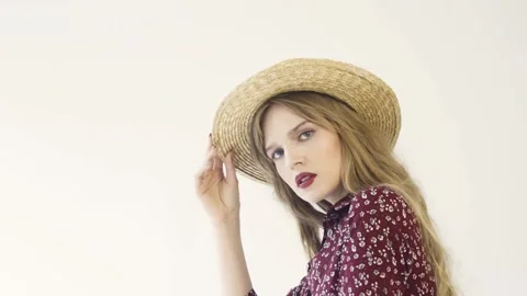 Girl in straw hat posing in studio. Slow motion. Stock Footage 114811201