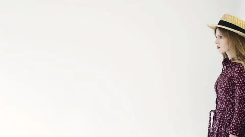 Girl in straw hat posing in studio. Slow motion. Stock Footage 114811306
