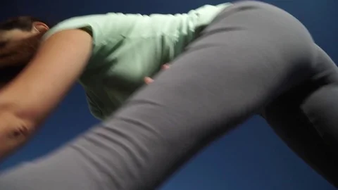 The girl stretches and warms up at the stadium Stock Footage