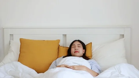 Girl stretching in bed after wake up at the morning. Stock Footage 101141282