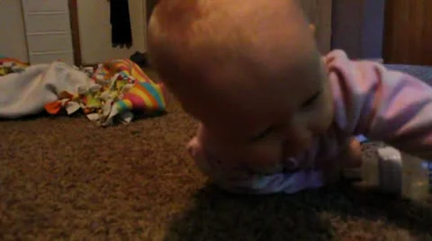 Girl struggles to crawl Stock Footage 11886898