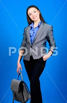 Girl student in formal clothes. Backpack fashion trend. Stylish woman in jacket Stock Photos