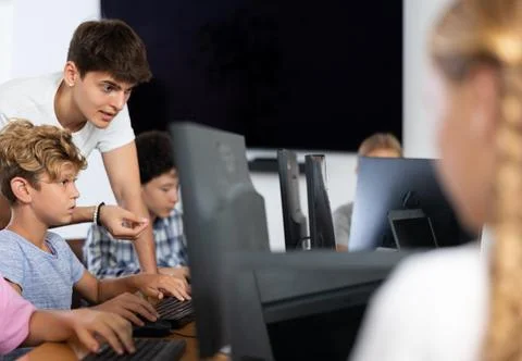 Girl student learning to work on computer in classroom Foto stock
