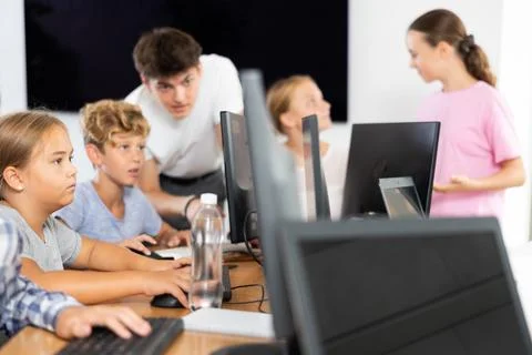 Girl student learning to work on computer in classroom Foto stock