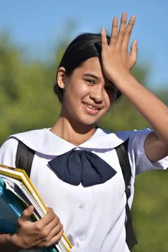 Girl Student Memory Problems Holding Books Foto stock