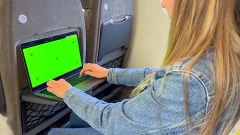 A girl student studies at a laptop while traveling on a train. Using a laptop Video stock 253174600