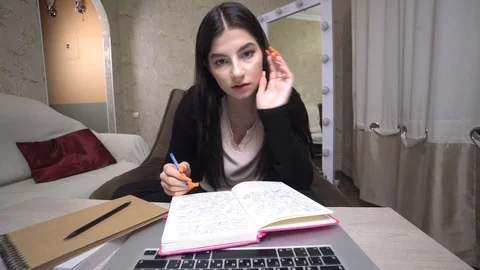 Girl student study online internet teacher talk by webcam looking at laptop Stock Footage 127236996