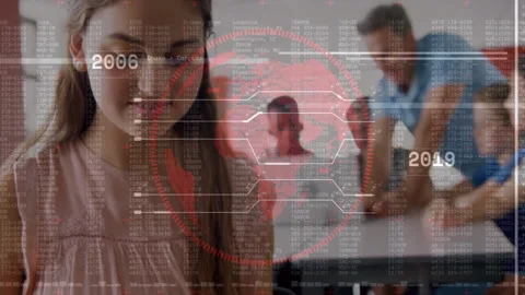 Girl student typing in computer lab, teacher assisting group, displaying Stock Footage 307463553