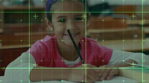 Girl student using pencil glancing down and writing paper in classroom green Stock Footage 329752278