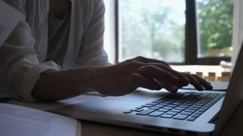 Girl student working at a computer. Close-up of women's hands typing on a laptop Stock Footage 136365913