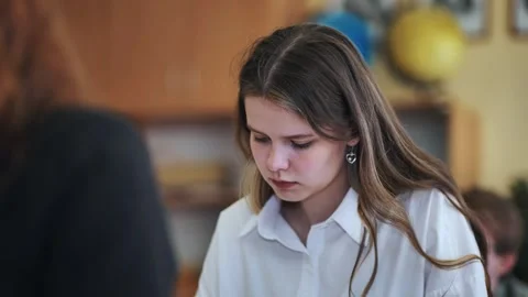 A girl student writes math formulas in a notebook. Stock Footage 258908029