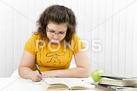 The girl the student with writing-books and books Stock Photos