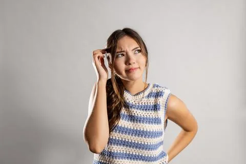 Girl in Studio Looking Puzzled Photos
