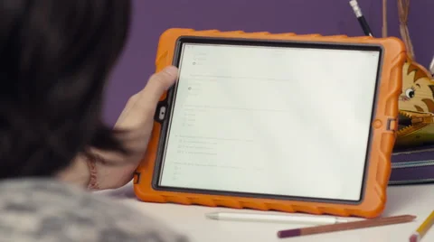 Girl studying using digital tablet at home Stock Footage 63861795