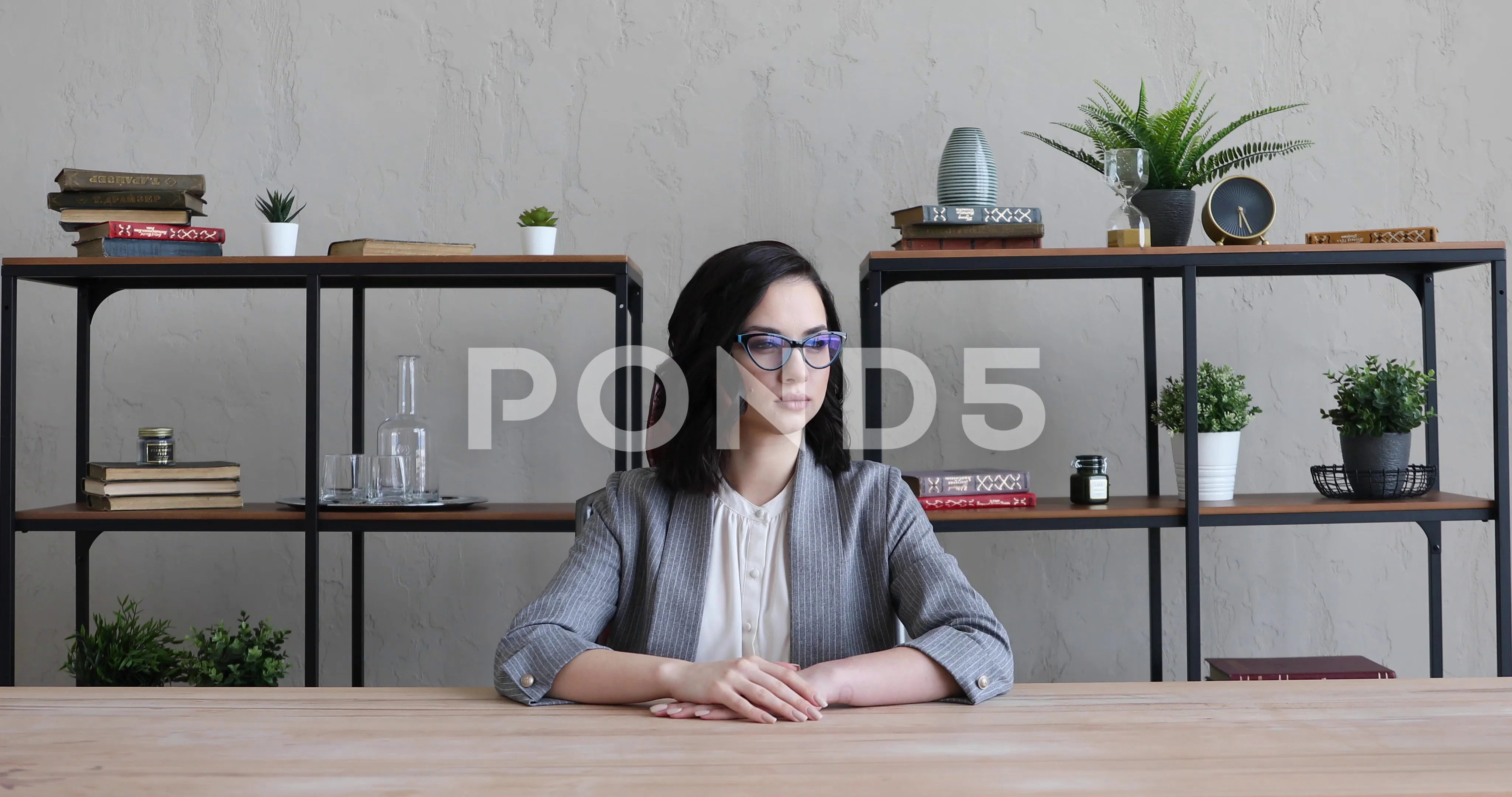 Pensive woman sitting at table in living room while thinking about next  chess move. Stock Photo by DC_Studio