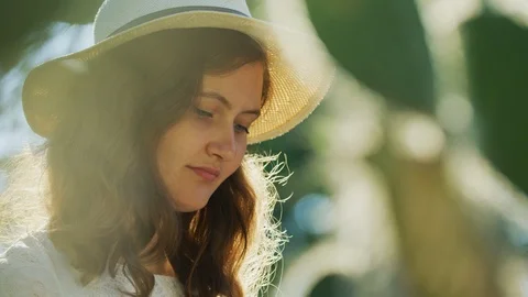 Girl with a summer hat Stock Footage 99963745