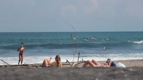 Girl Sunbathing on the Beach Stock Footage 67528759