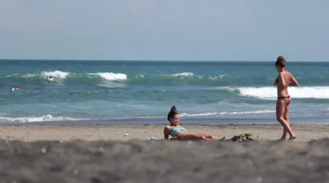 Girl Sunbathing on the Beach Stock Footage 67533202