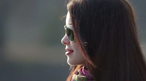 Girl in sunglasses talking with a guy Stock Footage 48484984