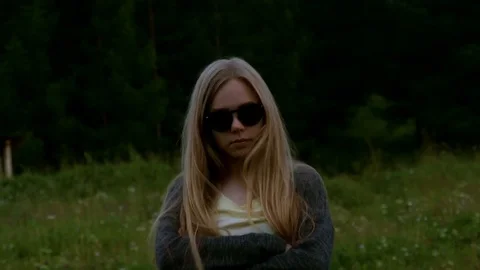 Girl in sunglasses is walking forward Video stock 80439883