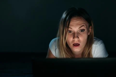 Girl surprised using laptop. Stock Photos