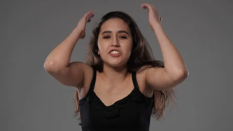 Girl swears at the camera Stock Footage 107034959