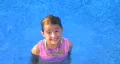 Girl Swimming and Smiling HD Footage