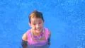 Girl Swimming and Smiling Footage