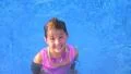 Girl Swimming and Smiling HD Footage