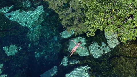 Girl Swimming in a Cenotes in Tulum Stock Footage