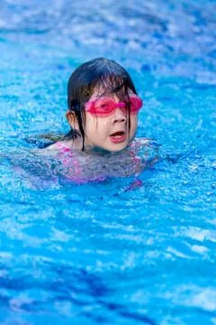 Girl Swimming in Pool Stock Photos