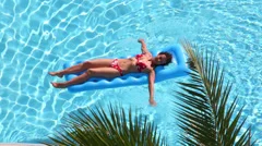 https://images.pond5.com/girl-swimsuit-floats-air-mattress-footage-035344781_iconm.jpeg