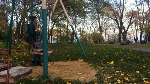 Girl on a swing 4K Stock Footage 82332003