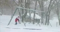Girl Swinging in Snow HD Footage