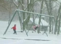 Girl Swinging in Snow SD Footage